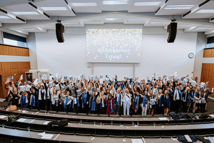 Group of people on the stage of the main auditorium
