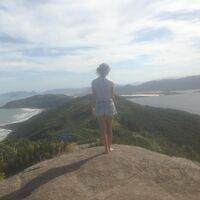 Ticen in front of a landscape