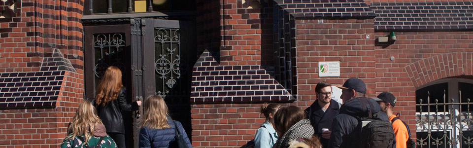 Students at the entrance to the main building of the Faculty of Textile and Clothing Technology