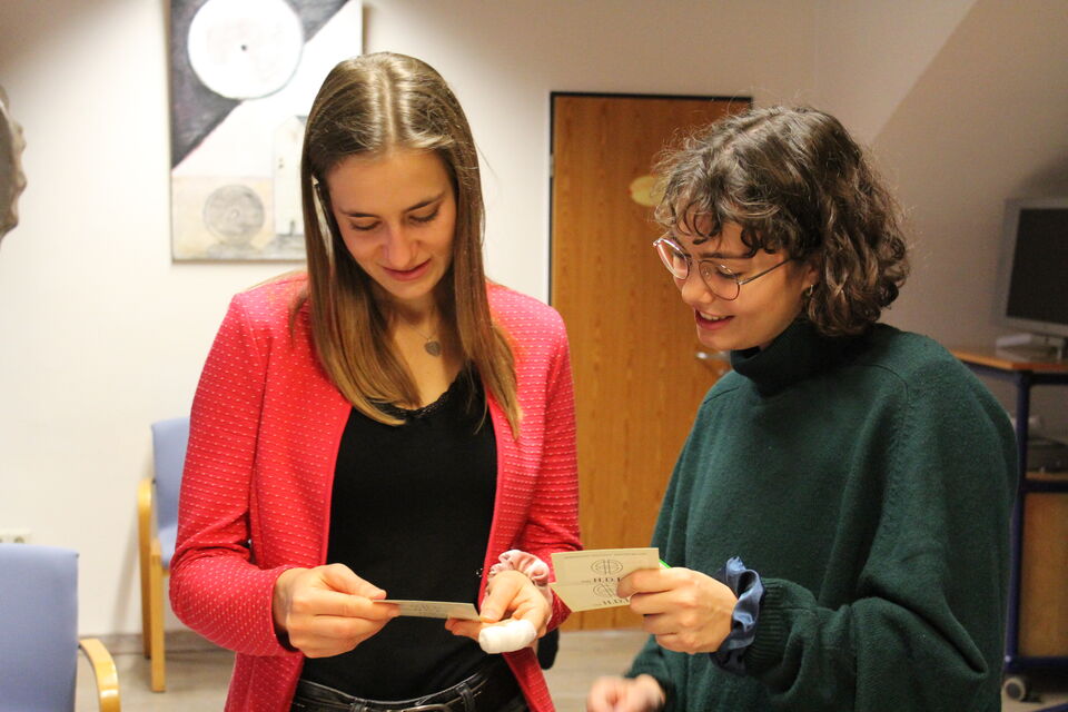 Two people, cards